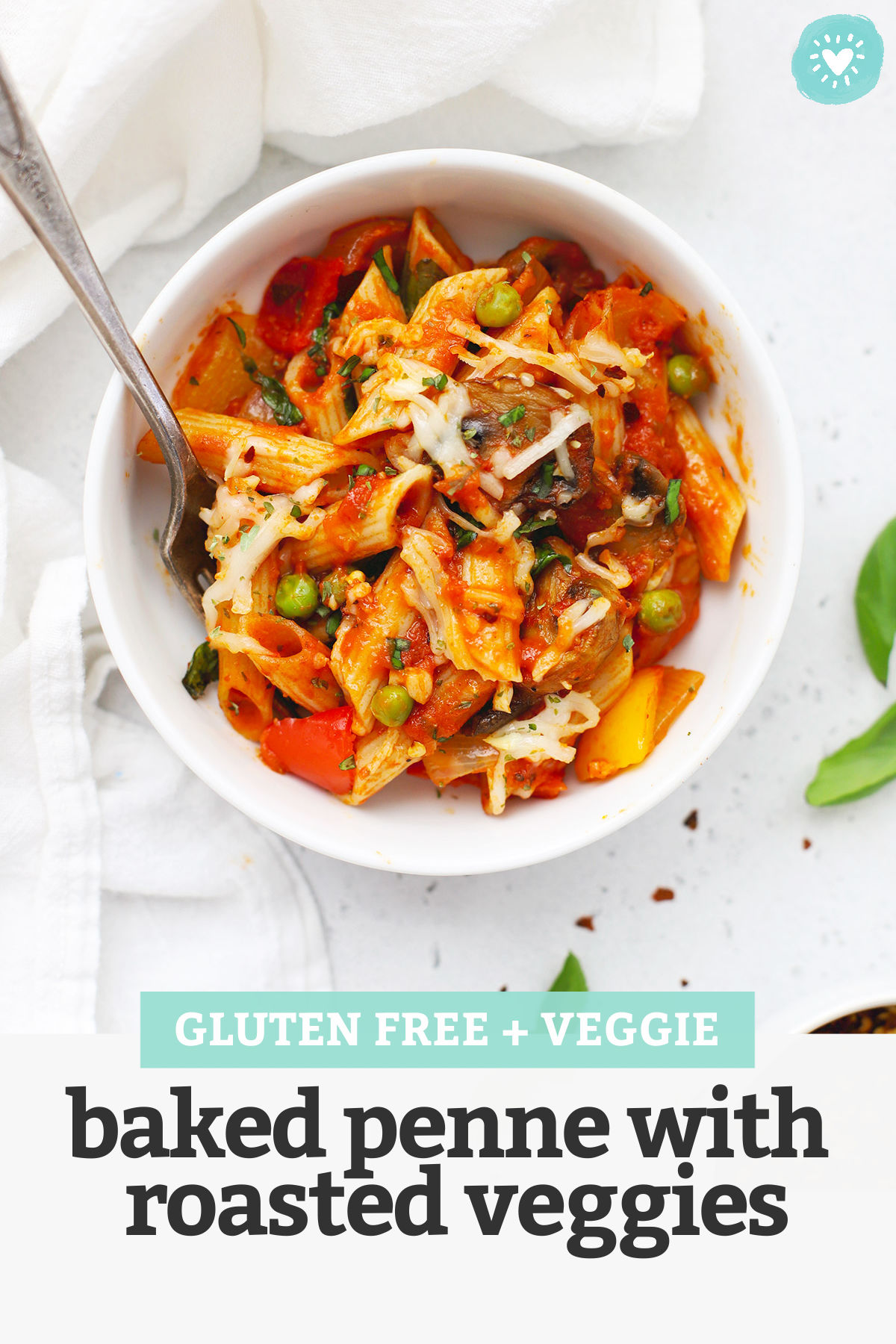 A white bowl of baked penne with roasted veggies with text overlay that reads "Gluten-Free + Veggie Baked Penne with Roasted Veggies"