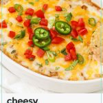 adding toppings to cheesy bean dip