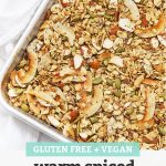 Sheet Pan of Gluten Free Warm Spiced Granola with text overlay that reads "Gluten-Free + Vegan Warm Spiced Granola - Easy + Yummy + Versatile"