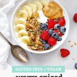 Yogurt Bowl with Warm Spiced Granola, fresh berries, sliced banana, and peanut butter with text overlay that reads "Gluten-Free + Vegan Warm Spiced Granola - Easy + Yummy + Versatile"