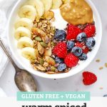 Yogurt Bowl with Warm Spiced Granola, fresh berries, sliced banana, and peanut butter with text overlay that reads "Gluten-Free + Vegan Warm Spiced Granola - Easy + Yummy + Versatile"