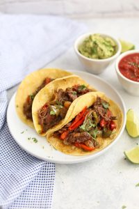 Slow Cooker Beef Carnitas - Tender beef cooked in the crock pot! These make amazing tacos, burritos, burrito bowls, taco salads, and more! (gluten free, paleo friendly)