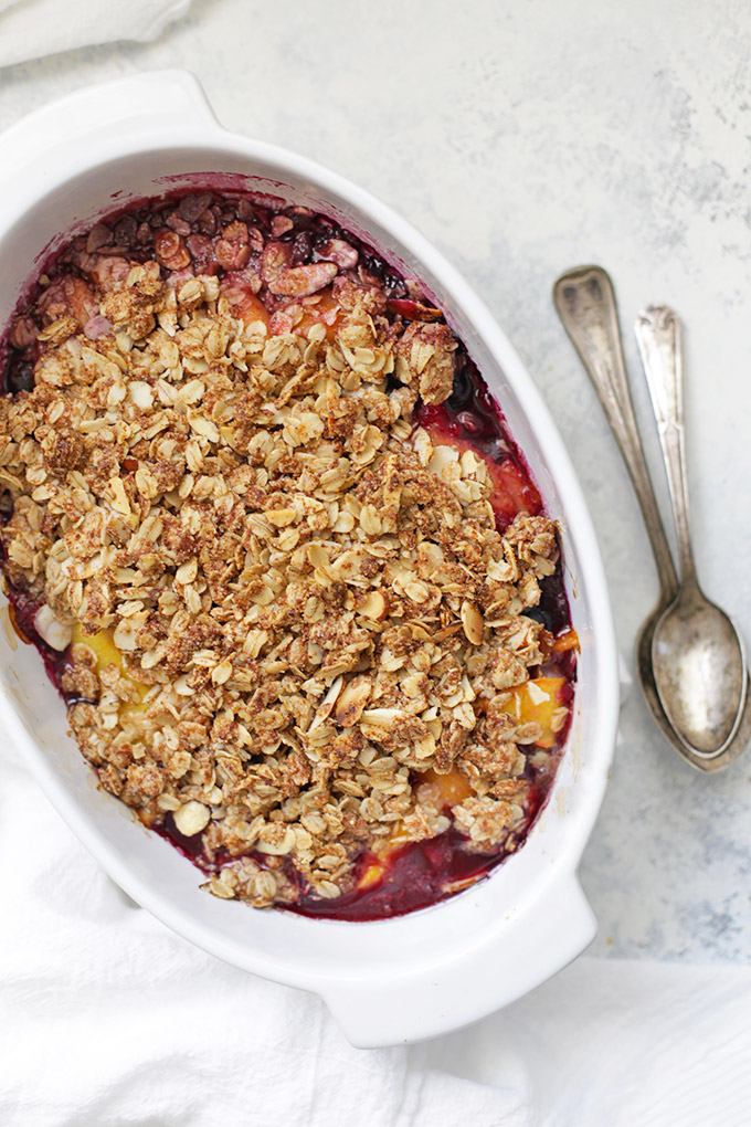 Peach Berry Crisp - Made with juicy, sweet peaches and a blend of raspberries and blueberries, this peach berry crisp is going to make your summer. (Gluten free and vegan to boot!)