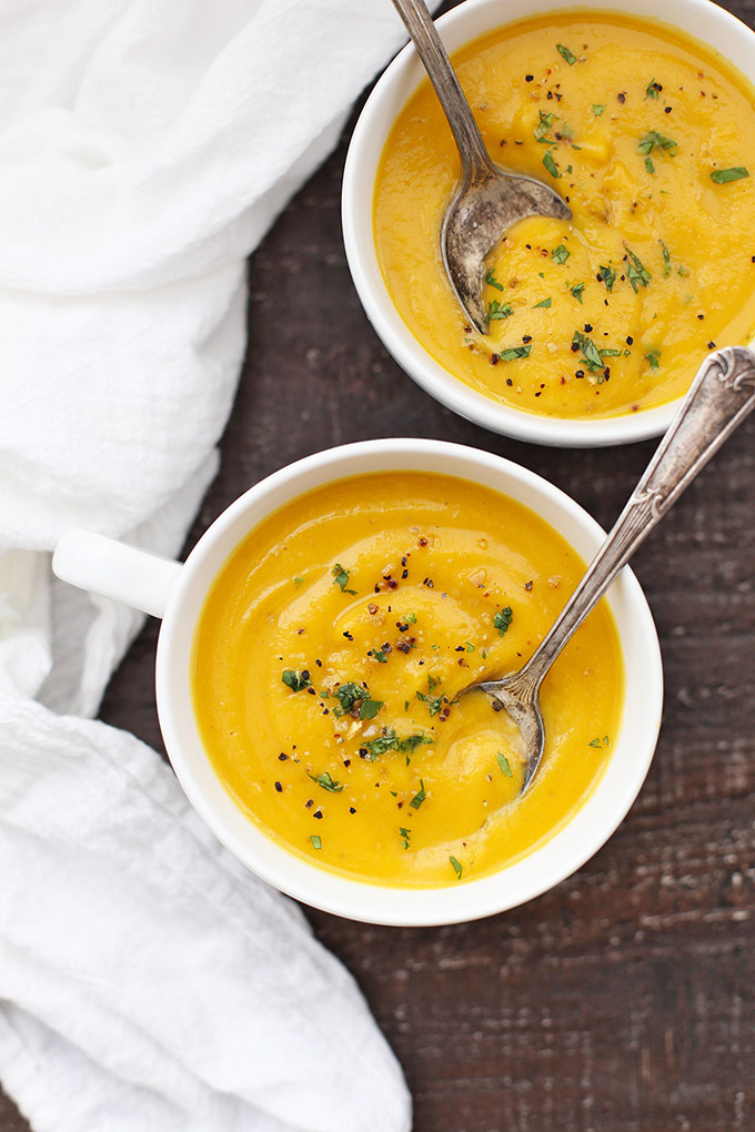 Creamy Roasted Butternut Squash Soup - This vegan and paleo soup is one of our family favorites. Silky smooth and completely delicious! 