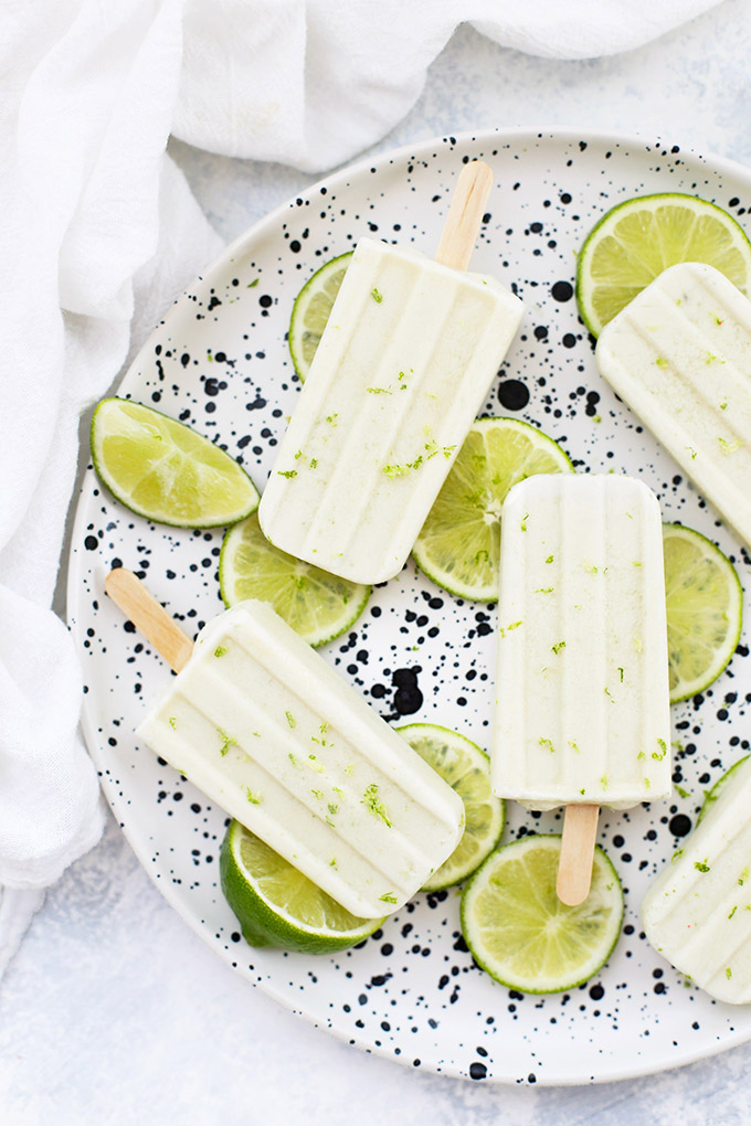 Paleo or Vegan Coconut Lime Popsicles - Dairy free, naturally sweetened, and so delicious! The perfect healthy popsicle recipe. 