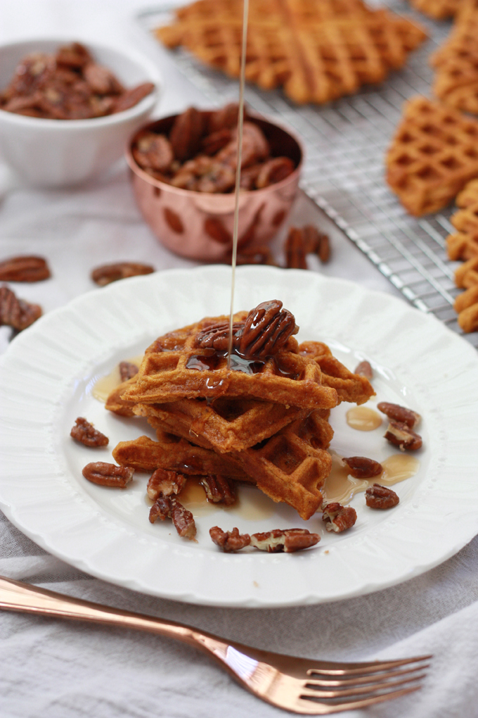 These Gluten Free Sweet Potato Waffles topped with maple candied pecans and syrup are a holiday breakfast dream come true. from www.onelovelylife.com
