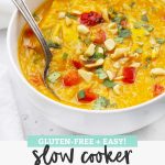 Close up front view of Slow Cooker Thai Curry Chicken and Butternut Squash Soup with text overlay that reads "Gluten-Free + Easy! Slow Cooker Thai Chicken and Butternut Soup"