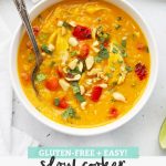 White bowl of slow cooker thai chicken and butternut squash soup with quinoa on a white background with text overlay that reads "Gluten-Free + Easy! Slow Cooker Thai Chicken + Butternut Soup"