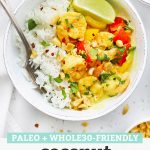 Overhead view of a bowl of paleo coconut shrimp curry with jasmine rice on a white background with text overlay that reads "Paleo + Whole30 Friendly Coconut Shrimp Curry"