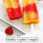 raspberry peach popsicles on a tray with ice
