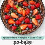 Overhead view of no bake chocolate berry tart on a white background with text overlay that reads "gluten-free + vegan + dairy-free no-bake chocolate berry tart"