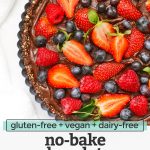 Overhead view of no bake chocolate berry tart on a white background with text overlay that reads "gluten-free + vegan + dairy-free no-bake chocolate berry tart"