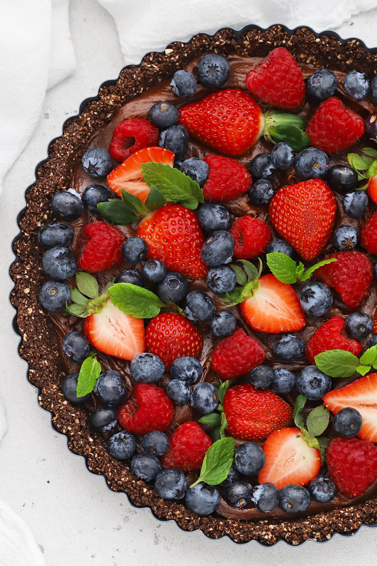 Gluten-free chocolate tart with berries