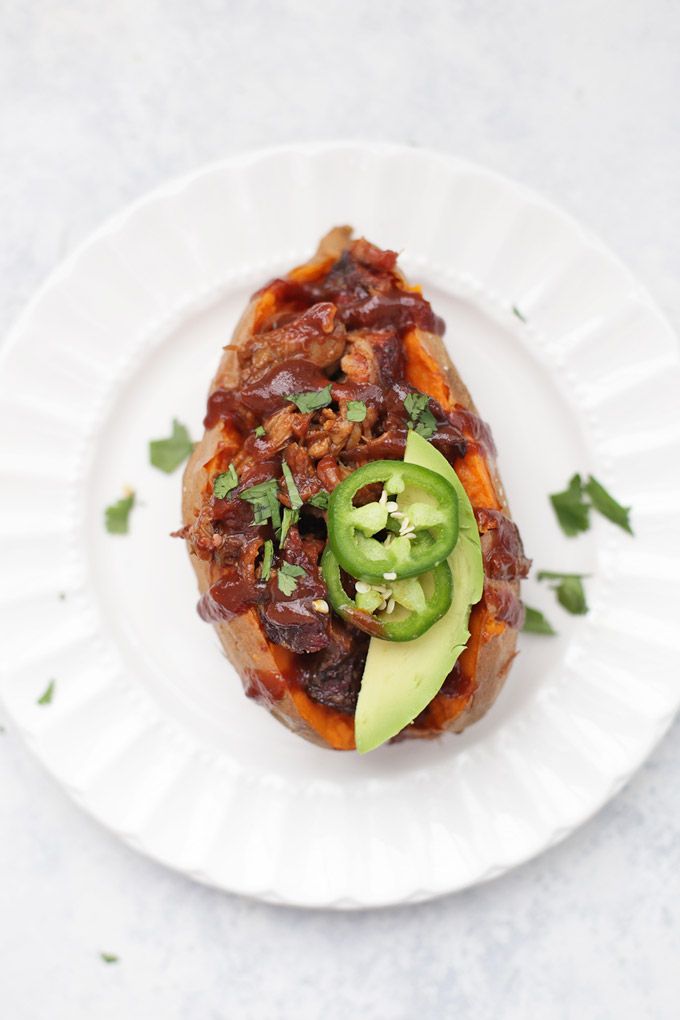 BBQ Pork Stuffed Baked Sweet Potatoes - Baked sweet potatoes topped with savory barbecue pulled pork, chicken, or beef. SO GOOD. 5 More ideas in this post!