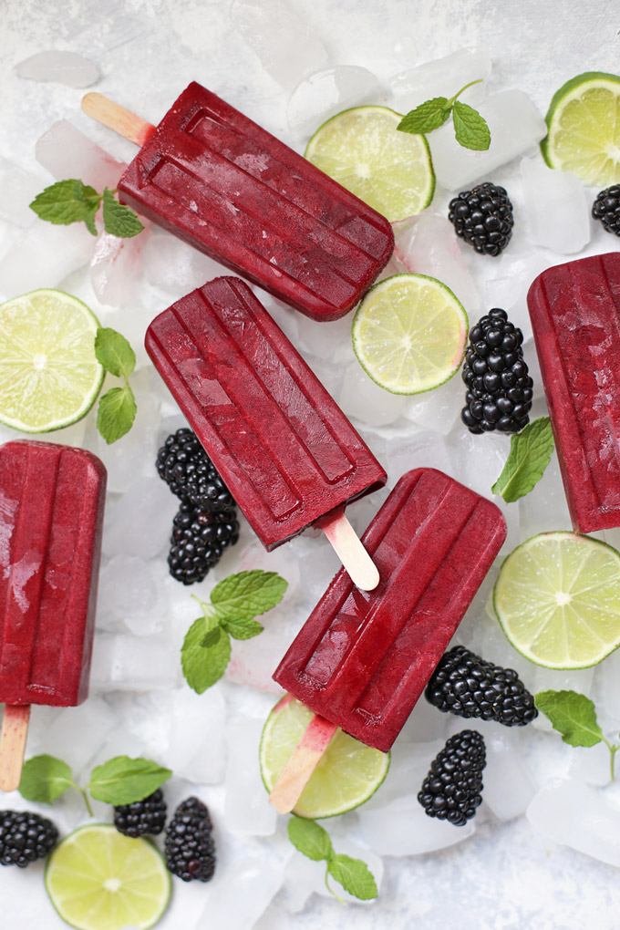These homemade popsicles are so refreshing! Made from sweet-tart blackberries, a twist of lime, and a kiss of mint, they're the perfect family friendly recipe for summer!