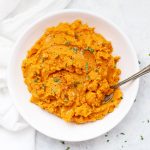 Chipotle Mashed Sweet Potatoes topped with salt, pepper, and a bit of minced cilantro