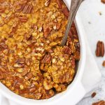 Baked Pumpkin Oatmeal - Studded with pecans and laced with the perfect blend of warm spices, this gluten free vegan breakfast is a fall favorite!