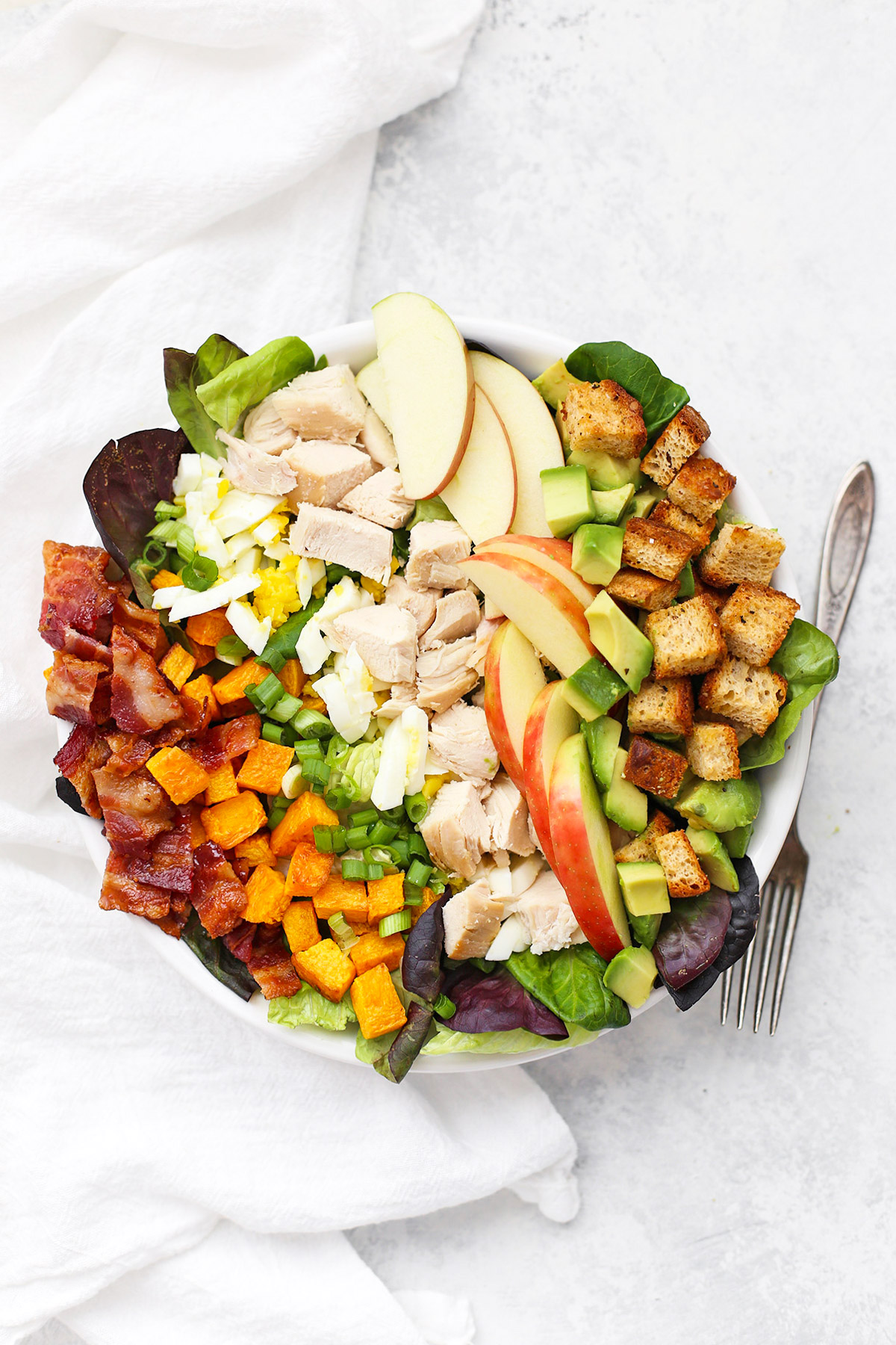 Fall cobb salad topped with apple cider dressing