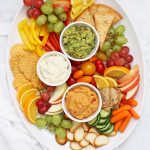 How to Make a Healthy Snack Board - An awesome hostess trick! (Plus, an amazing sun dried tomato avocado dip with gluten free flatbread crackers!)