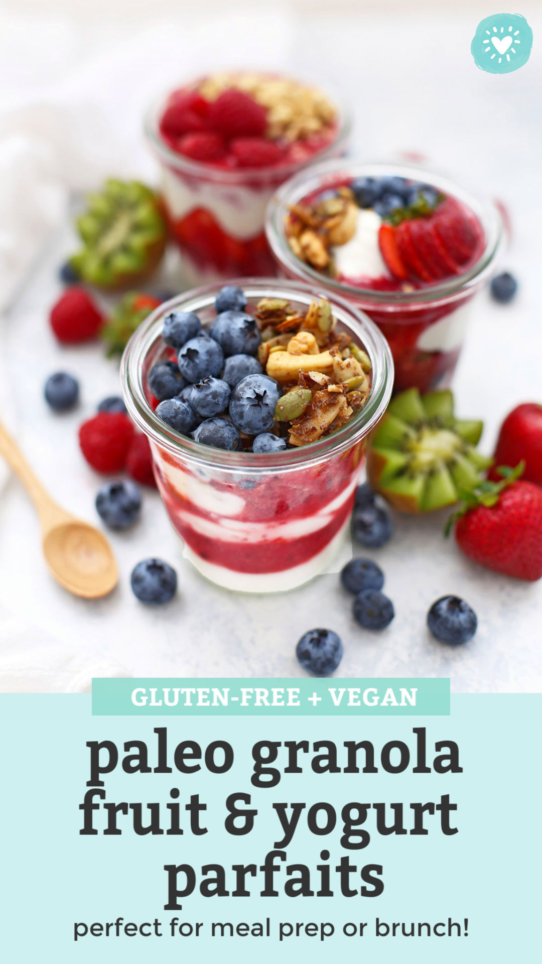 Front view of jars of paleo granola parfait with fresh fruit, yogurt, and berry puree with text overlay that reads "Gluten-Free + Vegan Paleo Granola Fruit & Yogurt Parfaits--Perfect for meal prep or brunch!"
