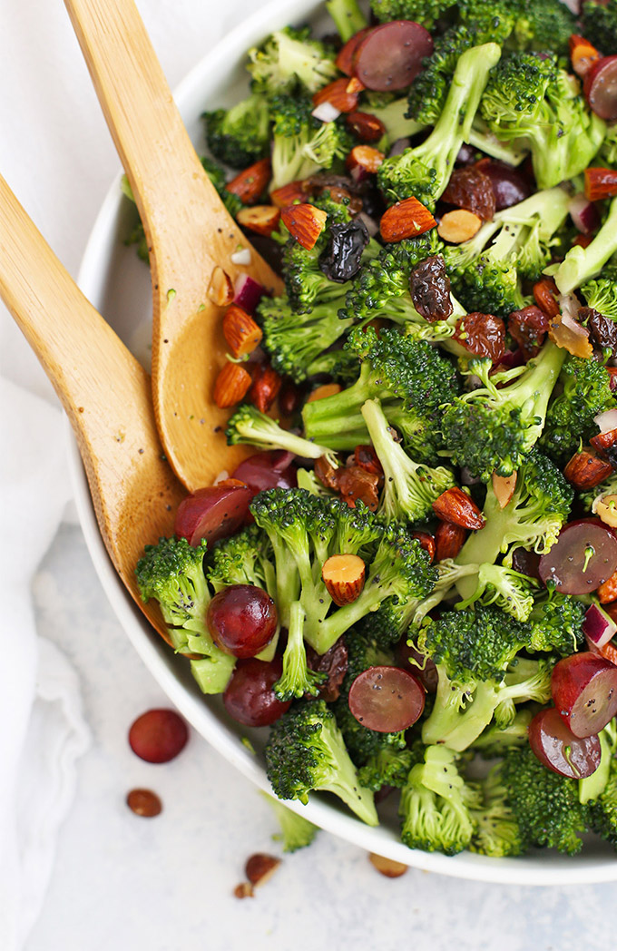 Close-up view of Vegan Broccoli Salad with Poppy Seed Dressing in a white salad bowl
