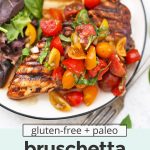 Overhead view of grilled bruschetta chicken with tomato basil topping and balsamic marinade. Text overlay reads "gluten-free + paleo + whole30 bruschetta chicken with balsamic marinade"