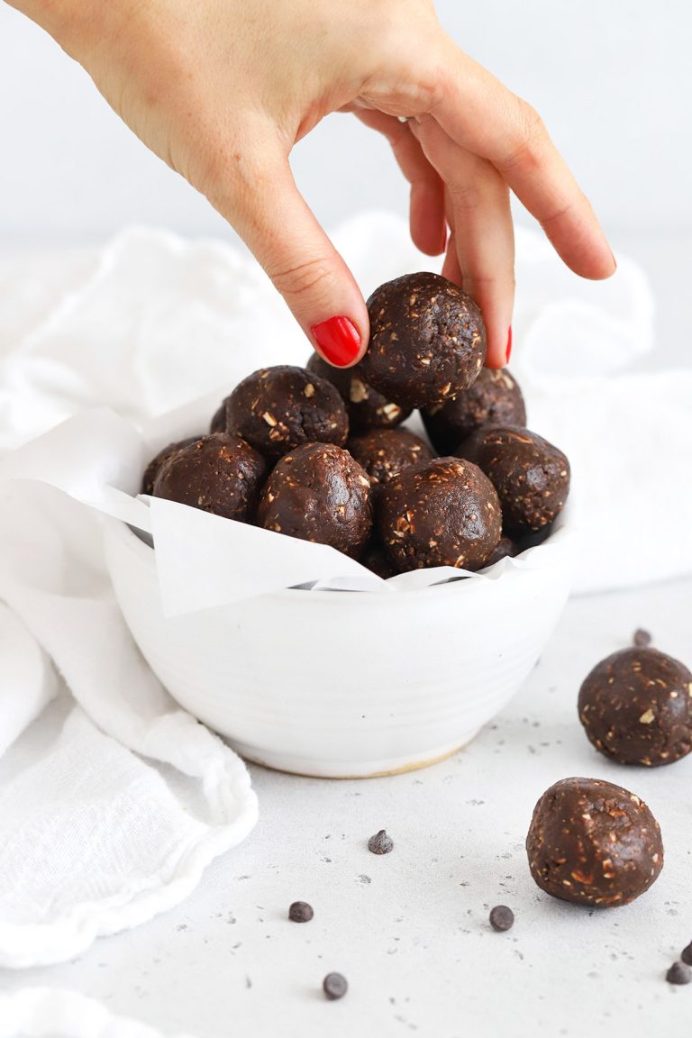 Chocolate peanut butter no-bake cookie energy bites in a white bowl