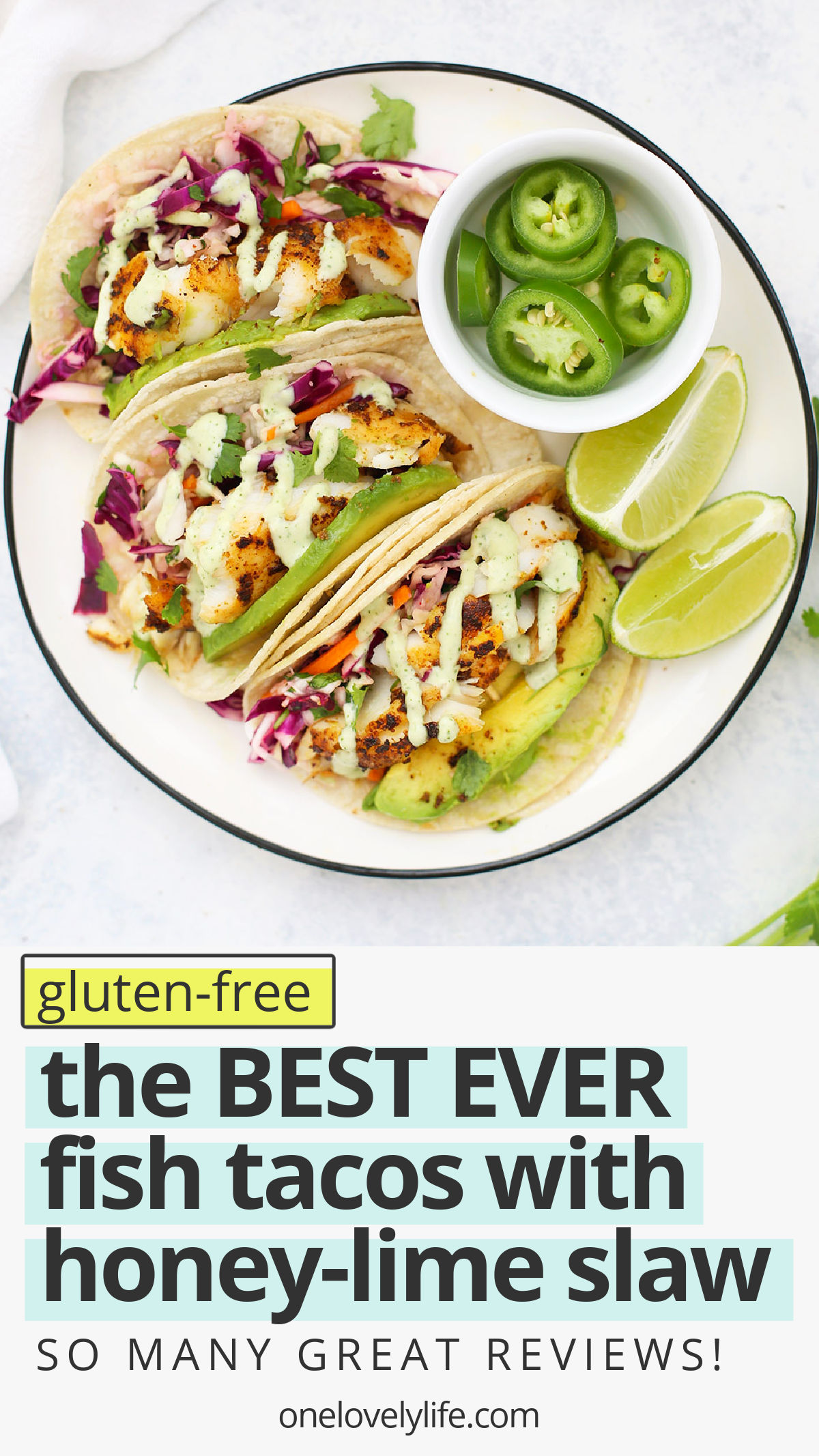 Gluten Free Fish Tacos with Honey Lime Cilantro Slaw - The BEST fish taco recipe! Perfectly cooked fish with an easy cabbage slaw that makes these taste amazing. // #onelovelylife #glutenfree #fishtacos #tacos // Gluten Free Dinner Ideas // Fish Tacos // Healthy Fish Tacos // Taco Recipe #fishtacos #tacos #glutenfree