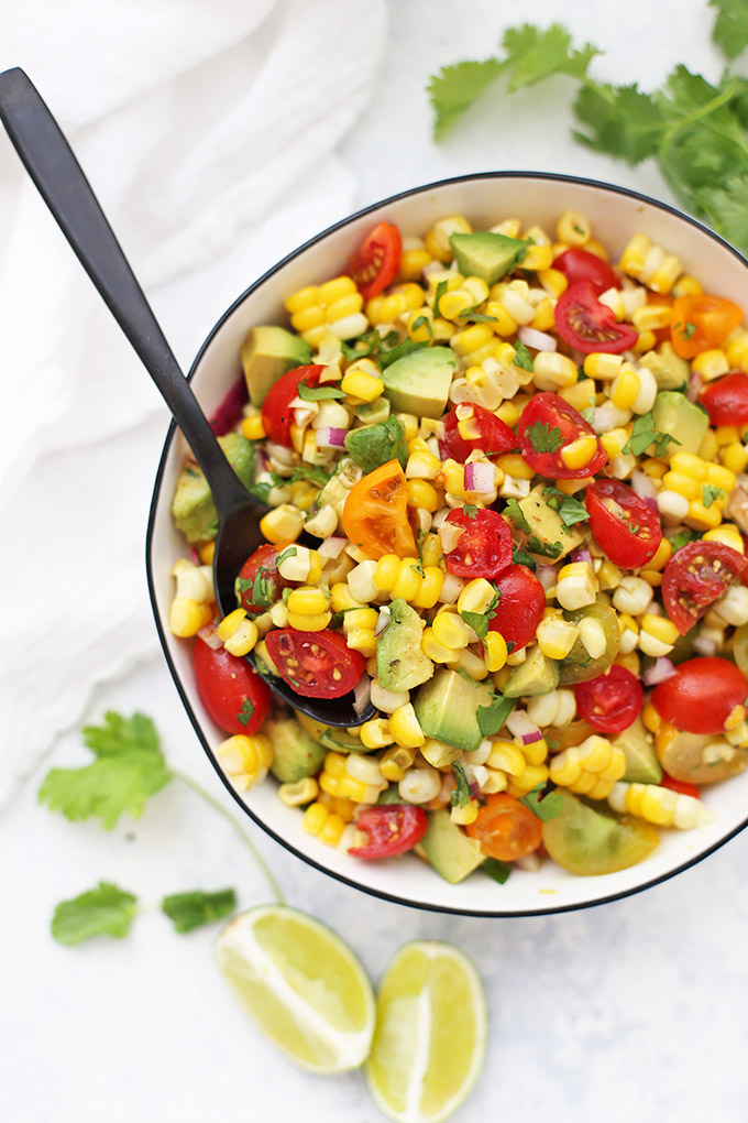 Fresh Corn Salad (or Corn Salsa!) with Avocado and Tomato - A delicious summer side dish! Enjoy as a salad, or use as chip dip or a topping for burrito bowls! Corn Salad / Corn Salsa / Gluten Free / Vegan / Dairy Free / Summer side dish / Summer salad / Fresh corn / corn recipes