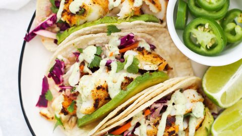 A plate of fish tacos with cilantro lime slaw