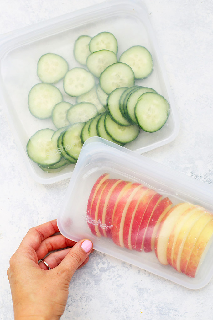 Stasher bags with sliced apples and cucumbers 