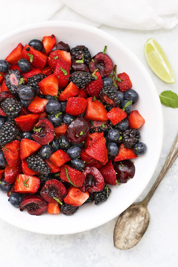 Cherry Berry Fruit Salad with Lime Mint Dressing - Strawberries, blackberries, blueberries, and cherries with lime mint dressing.