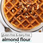 Crispy Almond Flour Pumpkin Waffles topped with syrup and pecans with text overlay that reads "gluten-free & dairy-free almond flour pumpkin waffles: healthy + easy + cozy"