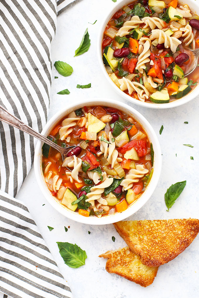 Close up view of two bowls of Vegetable Minestrone Soup. 
