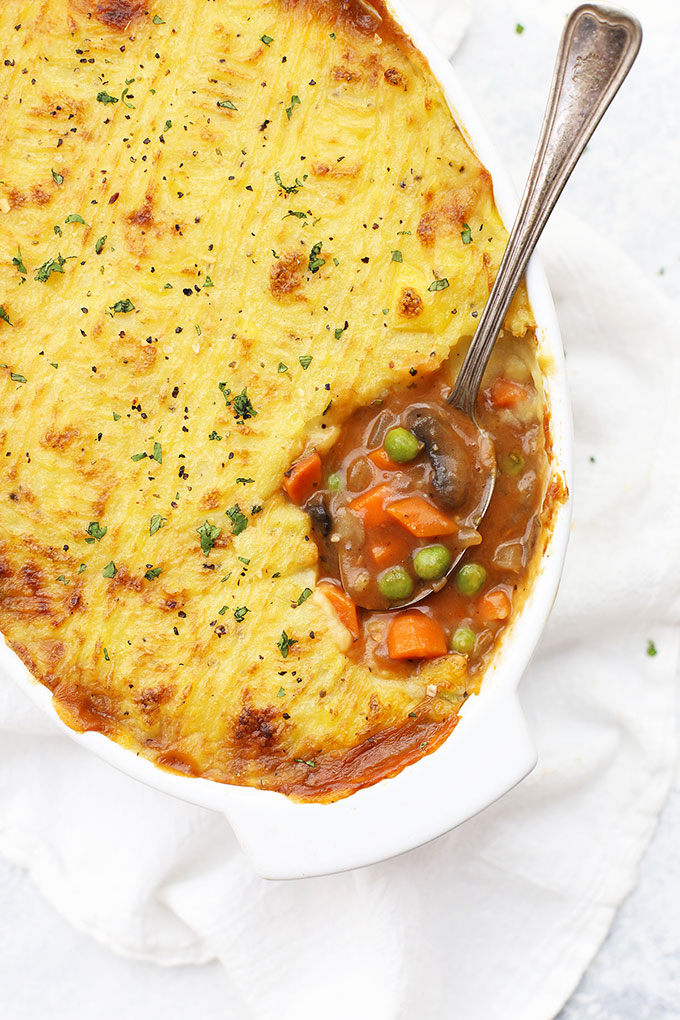 Close up view of vegetarian shepherd's pie. Spoonful of filling and mashed potato topping. 