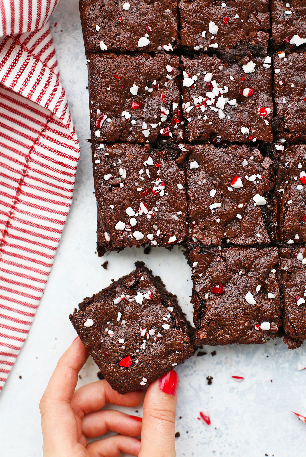 Hand taking a gluten free peppermint brownie