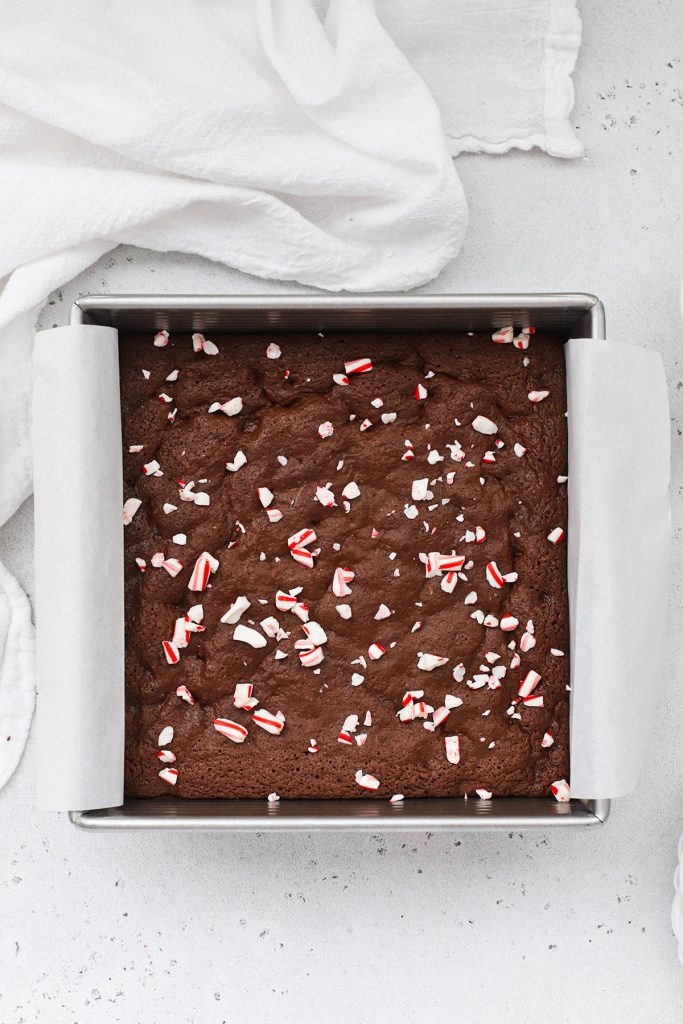 Adding crushed candy cane to gluten-free peppermint brownies