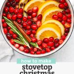 Overhead view of Christmas potpourri in a white saucepan with water. with text overlay that reads "How to Make Stovetop Christmas Potpourri +Free Printable Gift Tags"