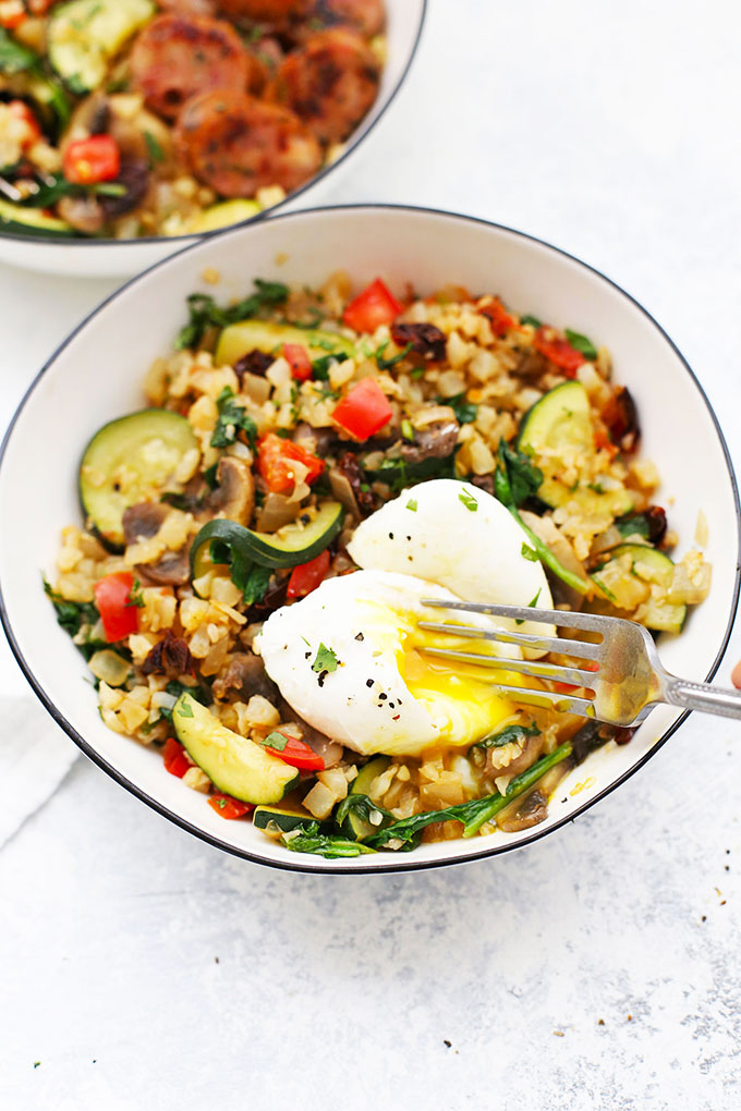 Mediterranean Cauliflower Rice Skillet with Poached Eggs from One Lovely Life