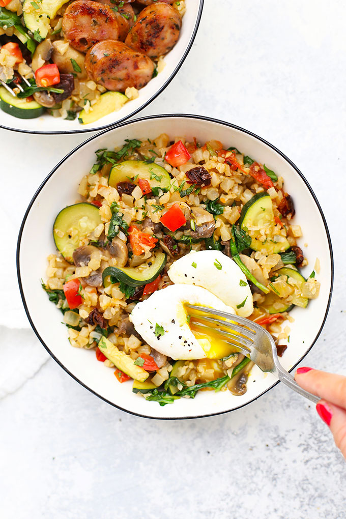 Mediterranean Cauliflower Rice Skillet with Poached Eggs from One Lovely Life