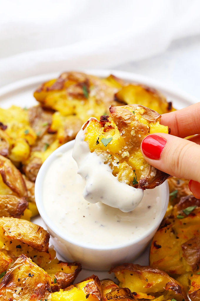 Crispy Smashed Potato Dipped in Ranch Dressing from One Lovely Life