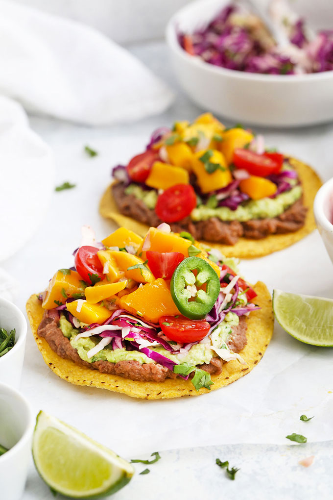 Black Bean Tostadas topped with Cilantro Slaw and Mango Salsa from One Lovely Life
