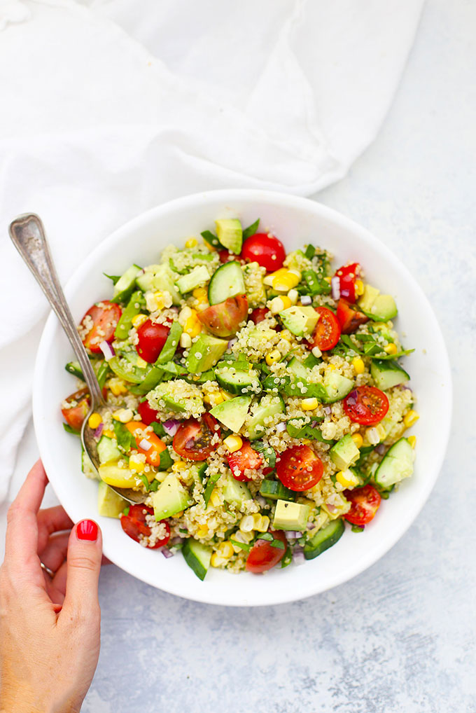 Farmers' Market Quinoa Salad from One Lovely Life in a white bowl.