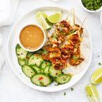 Gluten Free Chicken Satay with Peanut Sauce, rice, and Thai Cucumber Salad from One Lovely Life