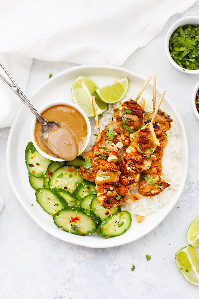 Gluten Free Chicken Satay with Peanut Sauce, rice, and Thai Cucumber Salad from One Lovely Life
