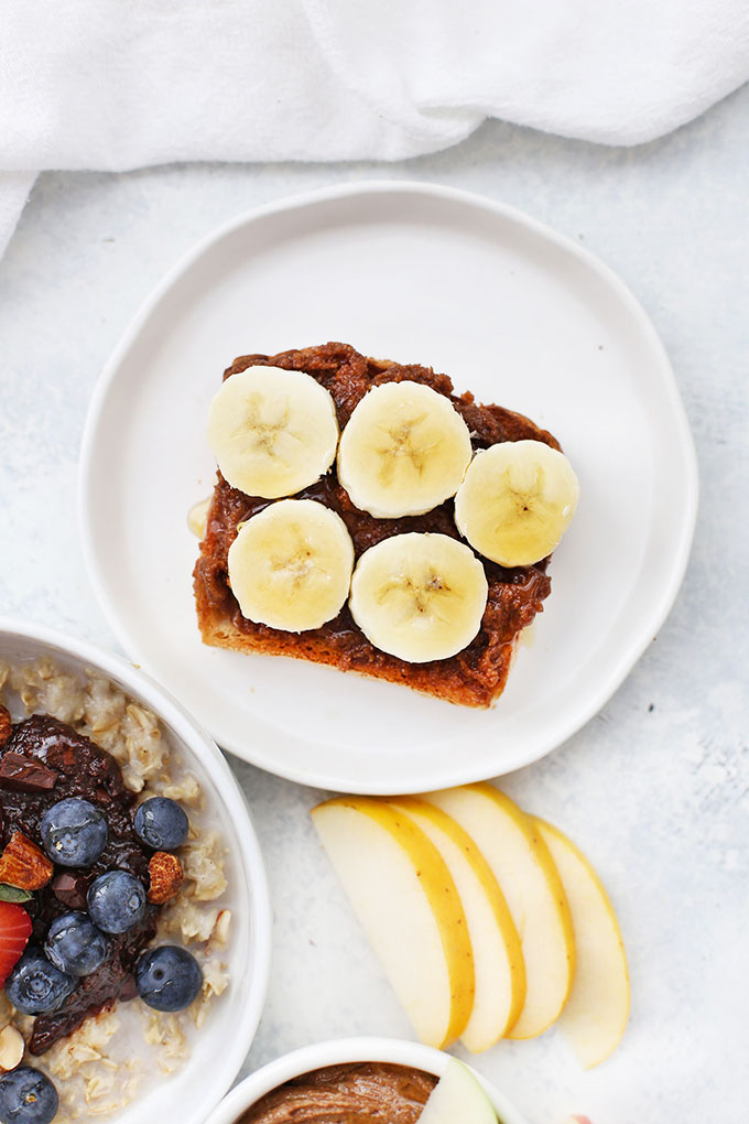 Maple Cinnamon Flavored Almond Butter on Toast with Sliced Bananas and Honey from One Lovely Life
