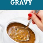 Ladle dipping into a white gravy boat of mushroom gravy with text overlay that reads "Gluten & Dairy-Free, Vegan + Whole30 Delicious Mushroom Gravy"