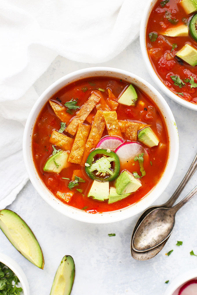 Vegetarian Tortilla Soup with tortilla strips and avocado from One Lovely Life