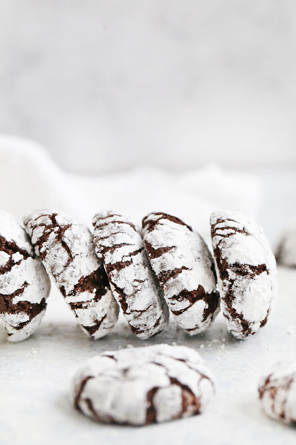 Front view of gluten-free chocolate crinkle cookies in a line