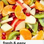 winter fruit salad with apples, oranges, kiwi, and pomegranate